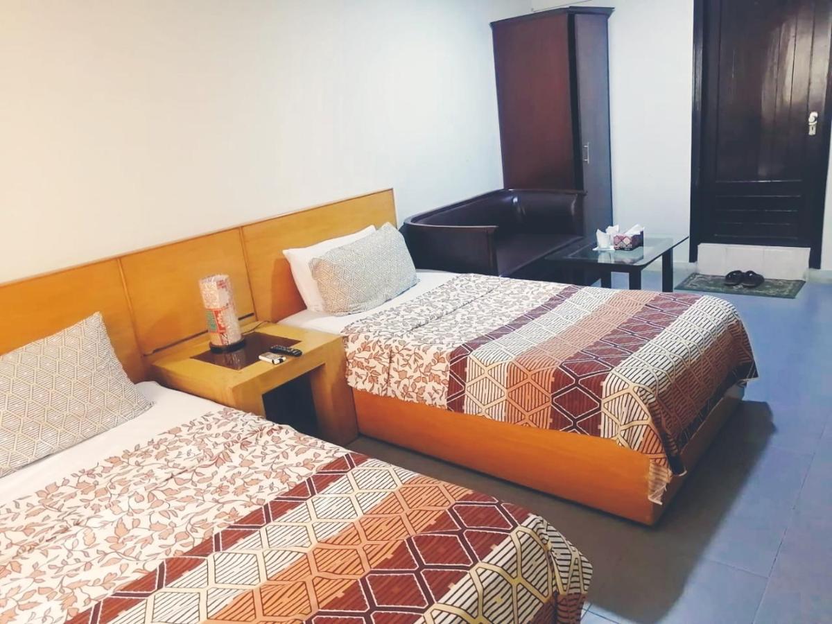 Hotel Rooms Dha Карачі Номер фото
