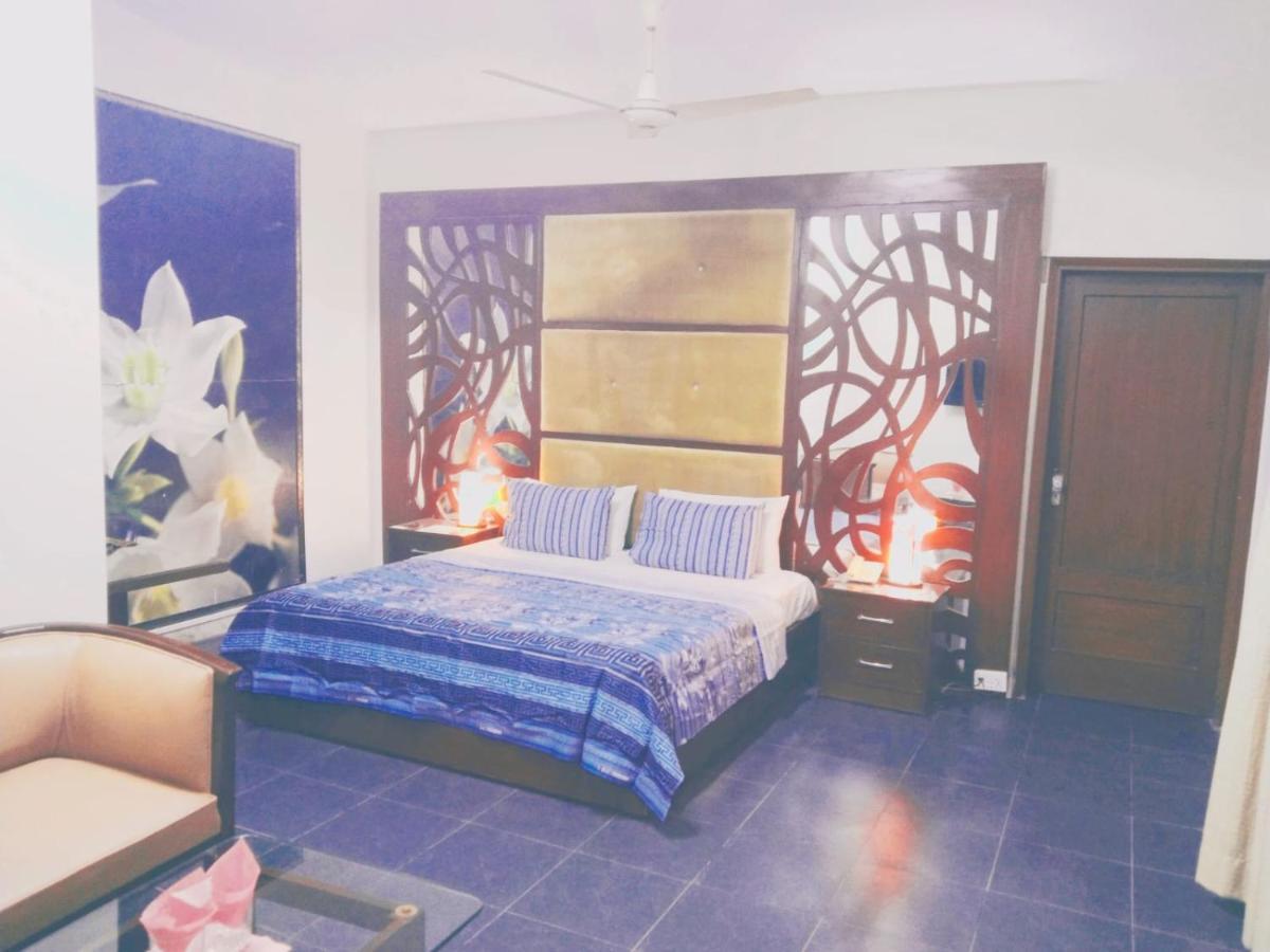 Hotel Rooms Dha Карачі Номер фото