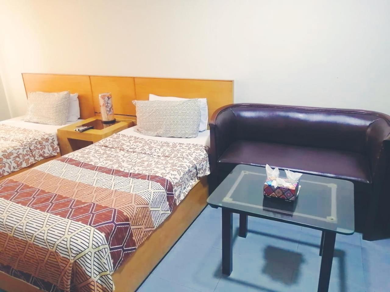 Hotel Rooms Dha Карачі Номер фото